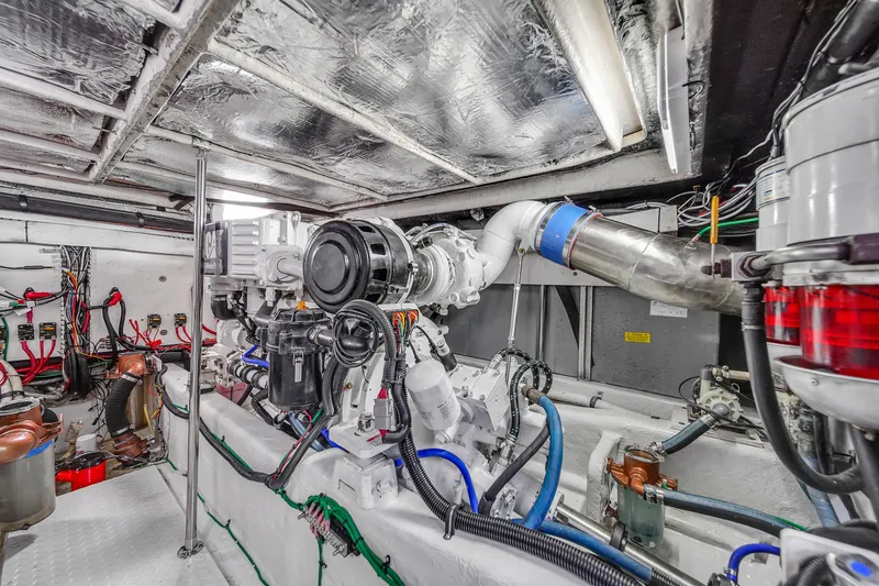 Slide: The Image of Engine room of a 2007 Sea Ray 52 Sedan Bridge yacht, showcasing mechanical components. - 71