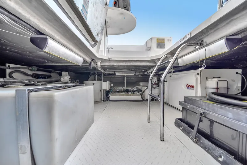 Slide: The Image of Engine room of a 2007 Sea Ray 52 Sedan Bridge yacht, showcasing equipment and storage. - 72