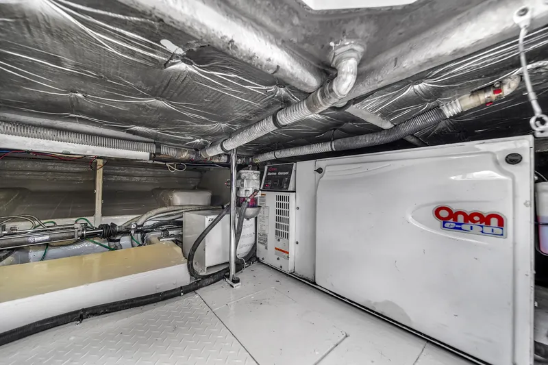 Slide: The Image of Engine room of a 2007 Sea Ray 52 Sedan Bridge with Onan generator. - 73
