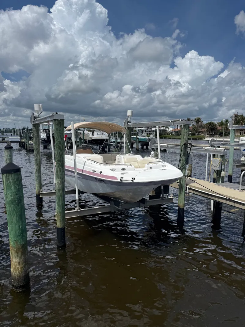 The Image of 2007 NauticStar 210 Sport Deck on boat lift at dock. - 0
