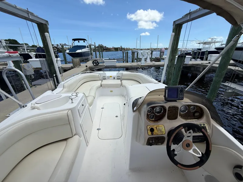 Slide: The Image of 2007 NauticStar 210 Sport Deck boat at dock. - 7