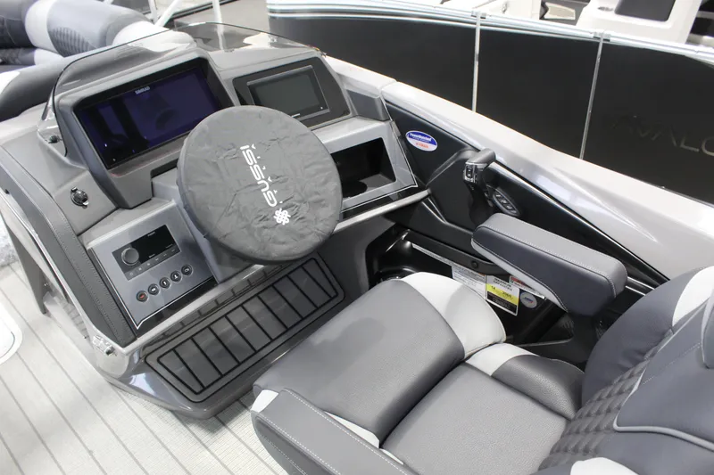 Slide: The Image of Interior of 2026 Avalon 2585 27-3 Excalibur LTD FL boat with modern dashboard and seating. - 4