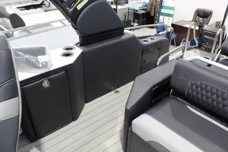 Slide: The Image of Interior of 2026 Avalon 2585 27-3 Excalibur LTD FL boat, featuring sleek seating and storage. - 6