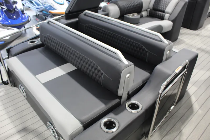 Slide: The Image of Luxurious seating on 2026 Avalon 2585 27-3 Excalibur LTD FL boat, featuring sleek design and cup holders. - 7