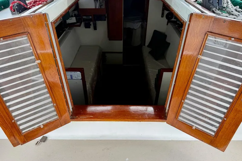 Slide: The Image of Cabin entrance of a 1975 Soverel 37 sailboat with wooden doors open. - 10