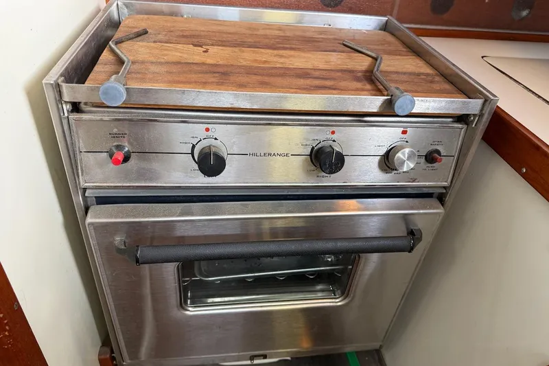 Slide: The Image of Stainless steel marine stove with wooden cover on a 1975 Soverel 37 yacht. - 18