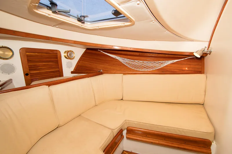 Slide: The Image of Interior of 1997 Hinckley Runabout 29 with beige seating and wooden accents. - 5