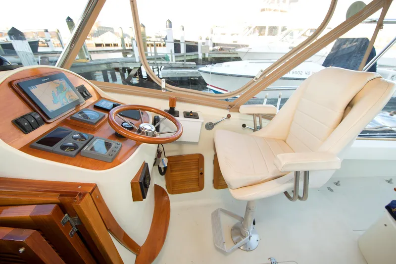 Slide: The Image of Interior of a 1997 Hinckley Runabout 29 boat with helm and navigation equipment. - 7