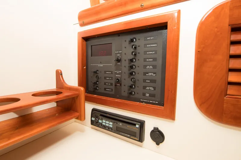 Slide: The Image of Control panel of a 1997 Hinckley Runabout 29 boat with wooden accents. - 9