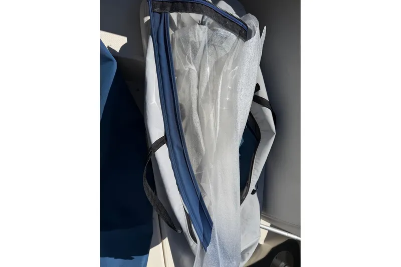 Slide: The Image of Protective cover for 2002 Sea Ray 240 Sundancer boat, partially unzipped. - 39