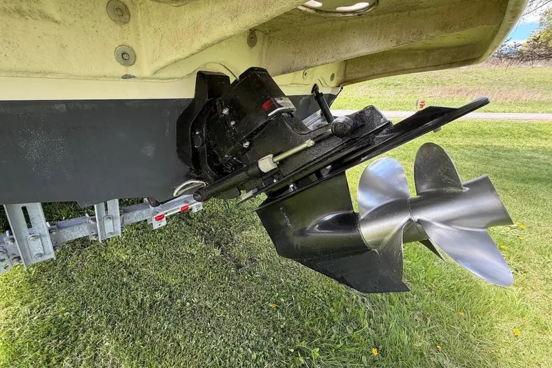 Slide: The Image of Propeller and stern drive of a 2002 Sea Ray 240 Sundancer boat on grass. - 9