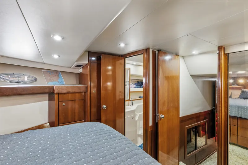 Slide: The Image of Luxurious interior of 2007 Meridian 490 Pilothouse yacht cabin with wood finishes. - 29