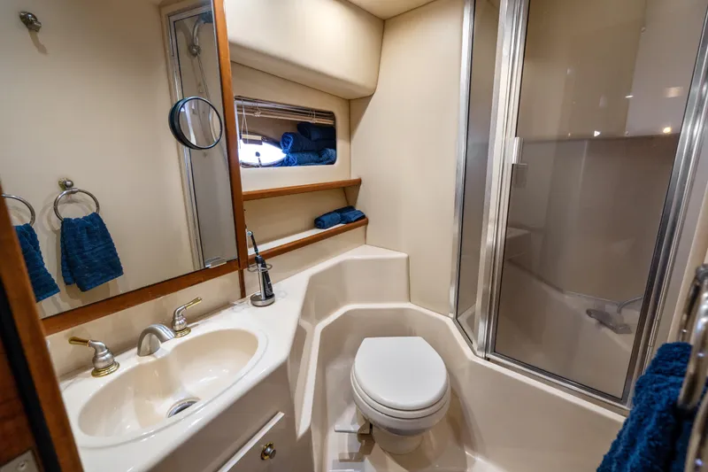 Slide: The Image of Luxurious bathroom in 2007 Meridian 490 Pilothouse yacht with shower and sink. - 32