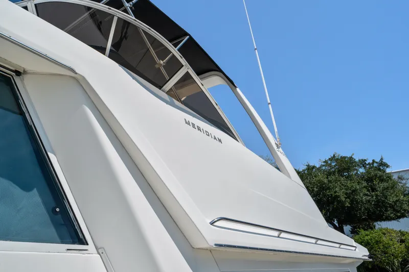 Slide: The Image of 2007 Meridian 490 Pilothouse yacht, sleek design under clear blue sky. - 50