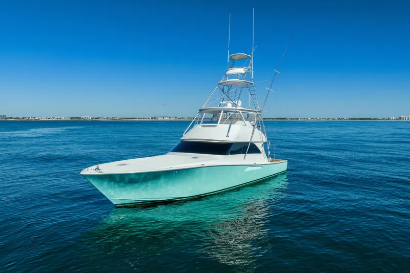 The Image of 2007 Viking 56 Convertible yacht on calm blue ocean under clear sky. - 1