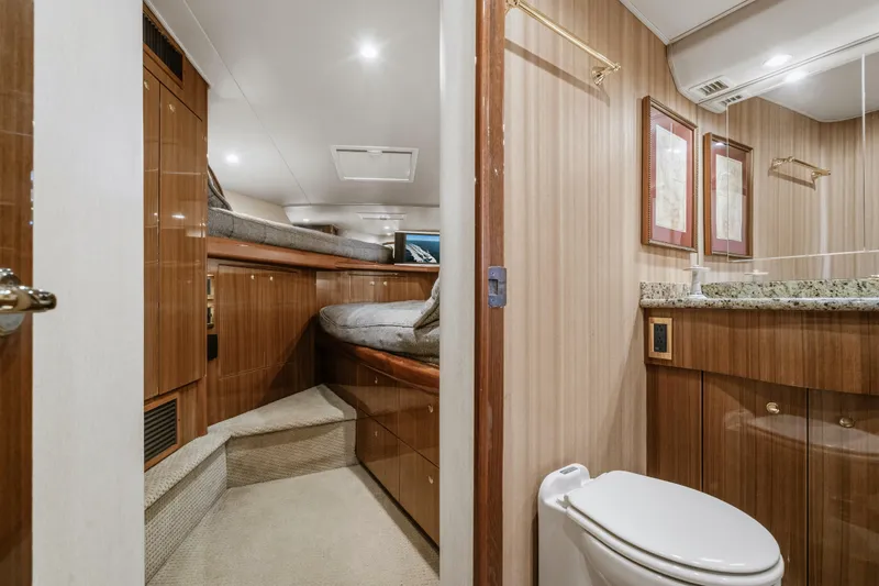 Slide: The Image of Luxurious 2007 Viking 56 Convertible yacht interior with bedroom and bathroom. - 25