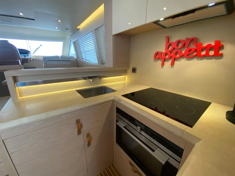 Slide: The Image of Modern kitchen in 2017 Beneteau Monte Carlo MC6 yacht with "bon appétit" decor. - 27