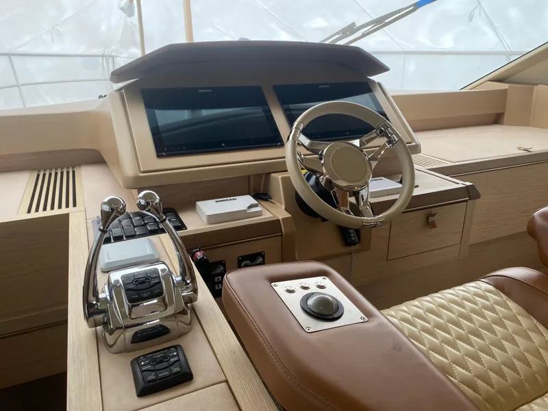 Slide: The Image of 2017 Beneteau Monte Carlo MC6 helm with modern controls and luxurious leather seating. - 31