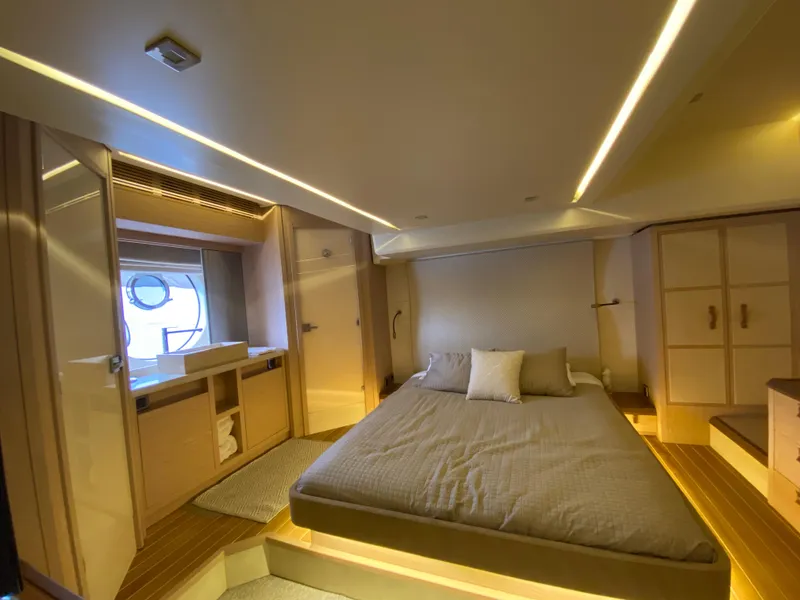 Slide: The Image of Luxurious bedroom interior of 2017 Beneteau Monte Carlo MC6 yacht, featuring modern design and ambient lighting. - 42