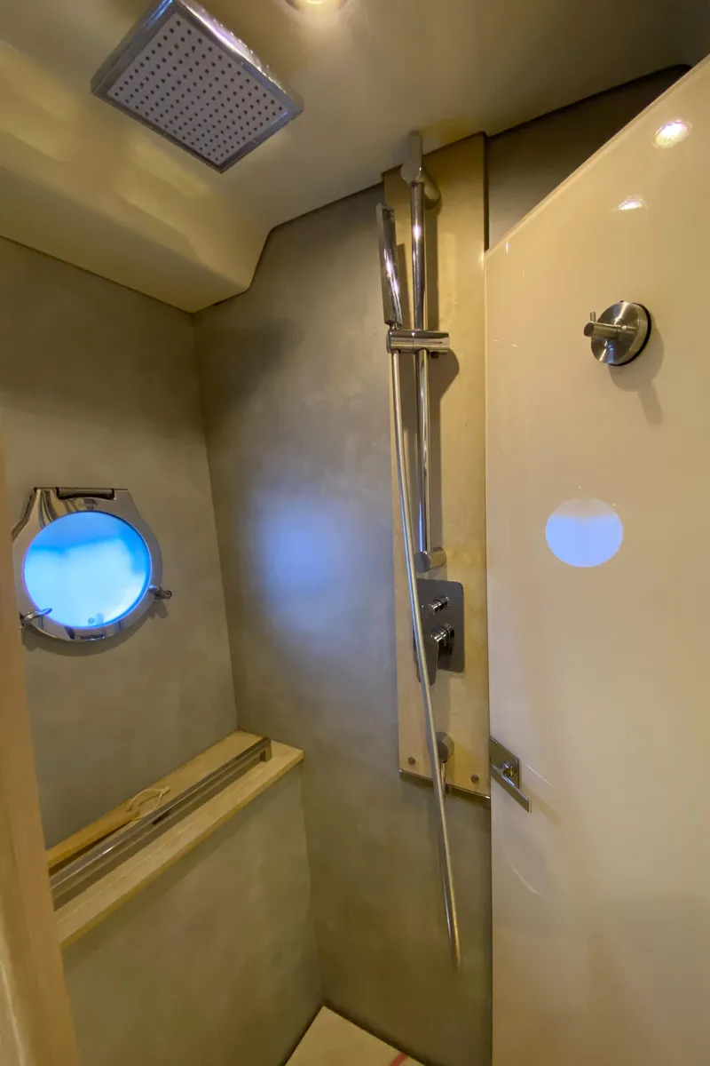 Slide: The Image of Shower area in 2017 Beneteau Monte Carlo MC6 yacht with modern fixtures and porthole. - 46
