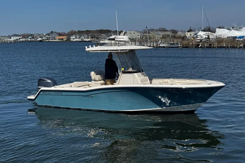 The Image of 2018 Grady-White Fisherman 236 boat on calm water, coastal background. - 0
