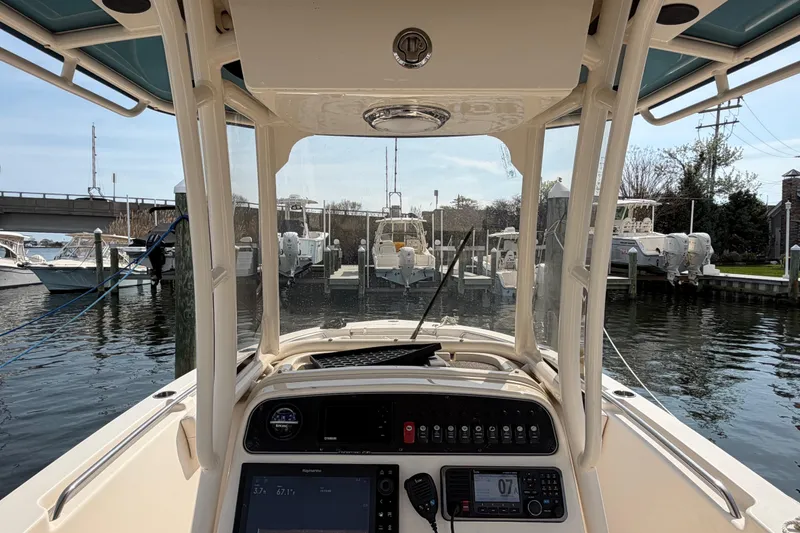 Slide: The Image of 2018 Grady-White Fisherman 236 boat dashboard view at marina. - 18