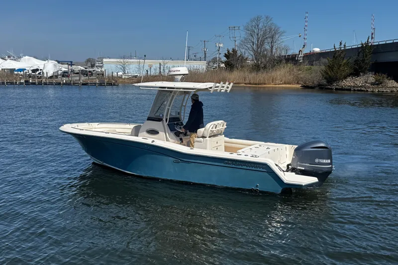 Slide: The Image of 2018 Grady-White Fisherman 236 boat on water, featuring Yamaha engine. - 3