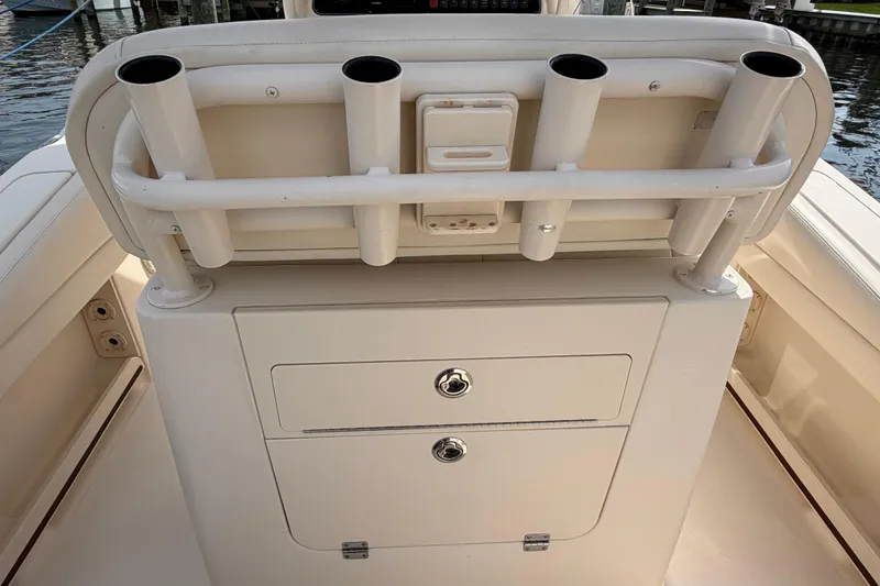 Slide: The Image of 2018 Grady-White Fisherman 236 boat console with rod holders and storage compartments. - 31