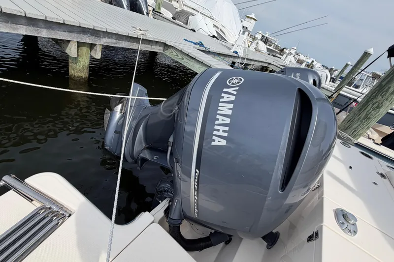 Slide: The Image of 2018 Grady-White Fisherman 236 with Yamaha outboard engine docked at marina. - 38