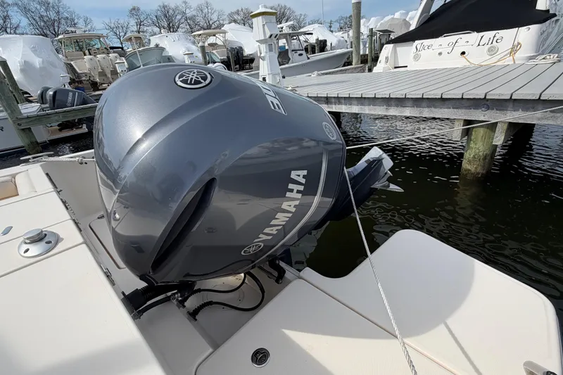 Slide: The Image of 2018 Grady-White Fisherman 236 with Yamaha outboard motor docked at marina. - 39