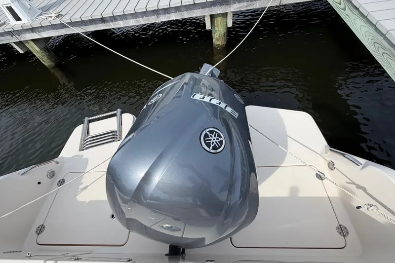 Slide: The Image of 2018 Grady-White Fisherman 236 with Yamaha outboard engine docked at marina. - 40
