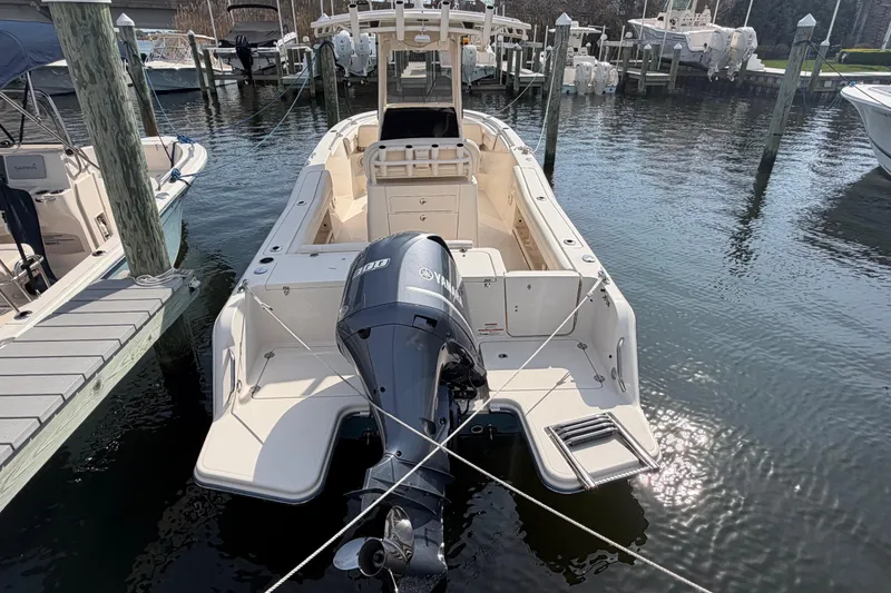 Slide: The Image of 2018 Grady-White Fisherman 236 boat docked with Yamaha outboard motor. - 42