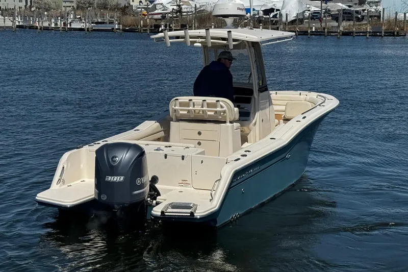 Slide: The Image of 2018 Grady-White Fisherman 236 boat on water, featuring Yamaha 300 engine. - 7