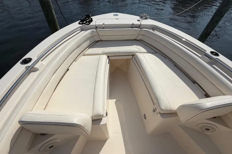 Slide: The Image of 2018 Grady-White Fisherman 236 boat interior with cushioned seating. - 9