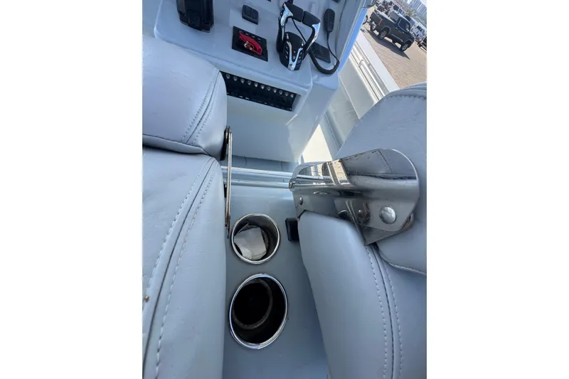 Slide: The Image of Interior of 2016 Contender 35 ST boat with cup holders and controls. - 12