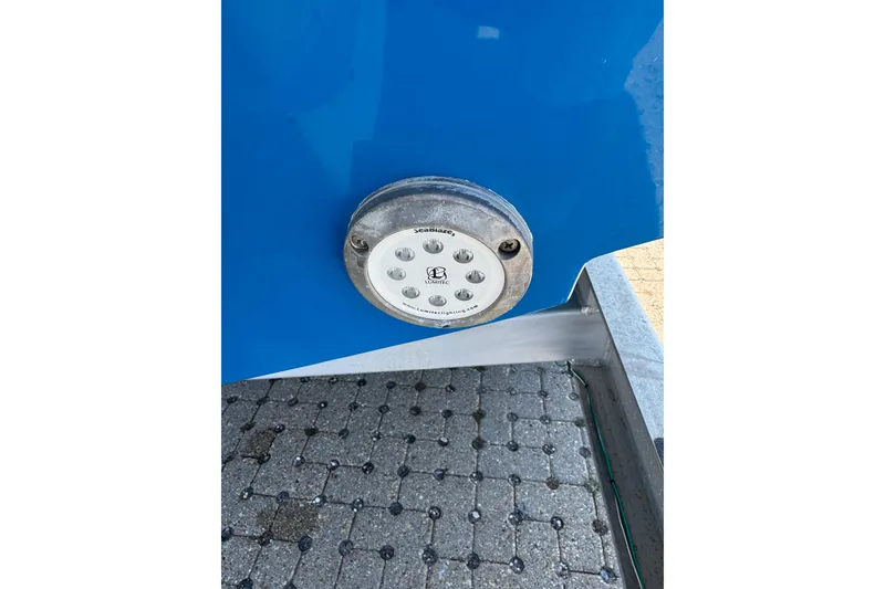 Slide: The Image of 2016 Contender 35 ST boat with underwater LED light on blue hull. - 13
