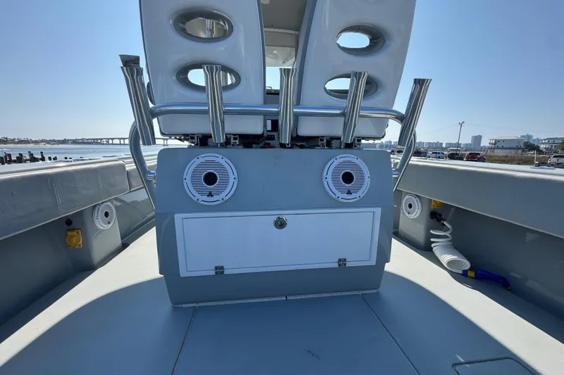 Slide: The Image of 2016 Contender 35 ST boat interior with speakers and storage, docked by the waterfront. - 15