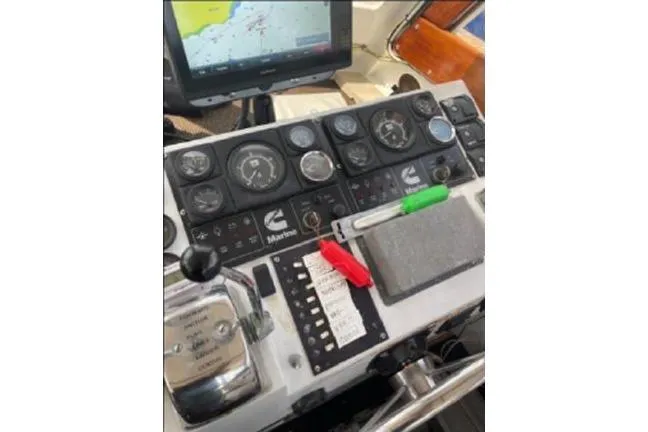 Slide: The Image of Control panel of a 1996 KenCraft Down East Express 35 boat with navigation equipment. - 10