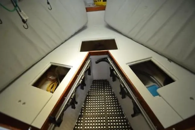 Slide: The Image of Interior of 1996 KenCraft Down East Express 35 boat with storage compartments. - 13