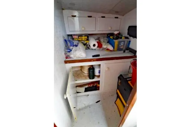 Slide: The Image of Interior storage area of a 1996 KenCraft Down East Express 35 boat. - 16