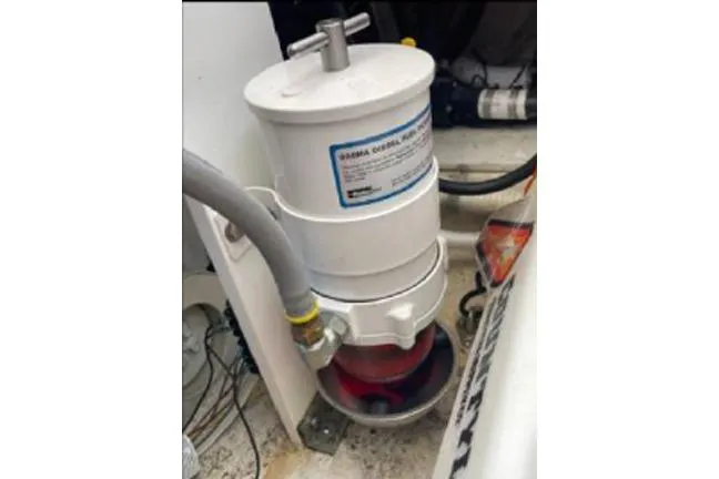 Slide: The Image of Fuel filter system in 1996 KenCraft Down East Express 35 boat engine compartment. - 19