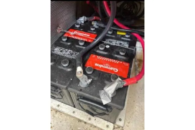 Slide: The Image of Batteries in a 1996 KenCraft Down East Express 35 boat with red and black cables. - 20
