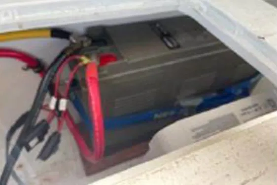 Slide: The Image of Battery compartment of a 1996 KenCraft Down East Express 35 boat with visible wiring. - 21