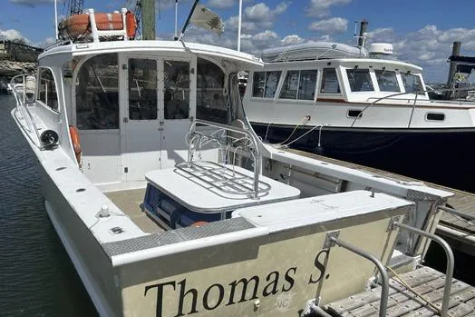 Slide: The Image of KenCraft Down East Express 35 boat, 1996 model, docked at marina under blue sky. - 24