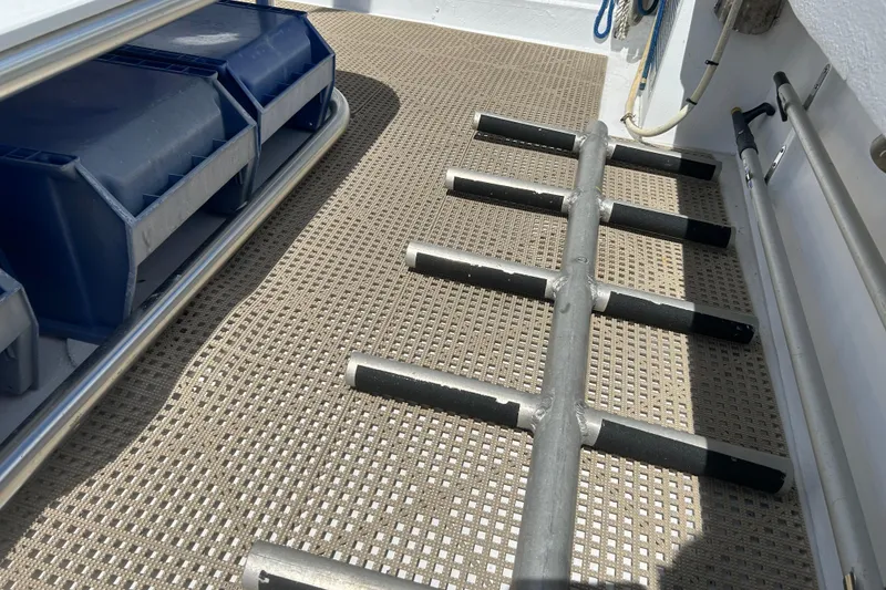 Slide: The Image of Deck of 1996 KenCraft Down East Express 35 with storage bins and ladder. - 27