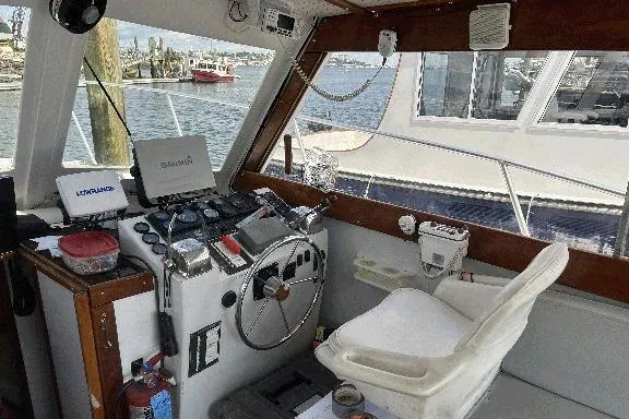 Slide: The Image of Interior of a 1996 KenCraft Down East Express 35 boat cockpit with navigation equipment. - 8