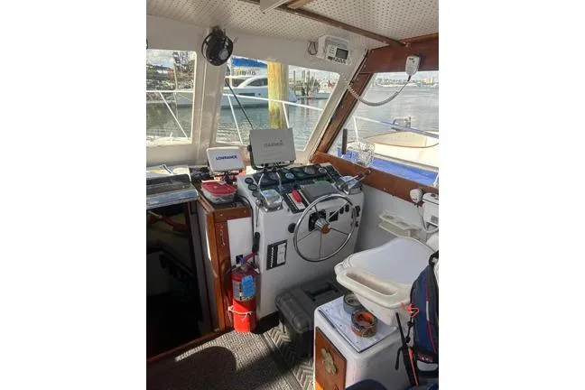 Slide: The Image of Interior of a 1996 KenCraft Down East Express 35 boat with navigation equipment. - 9