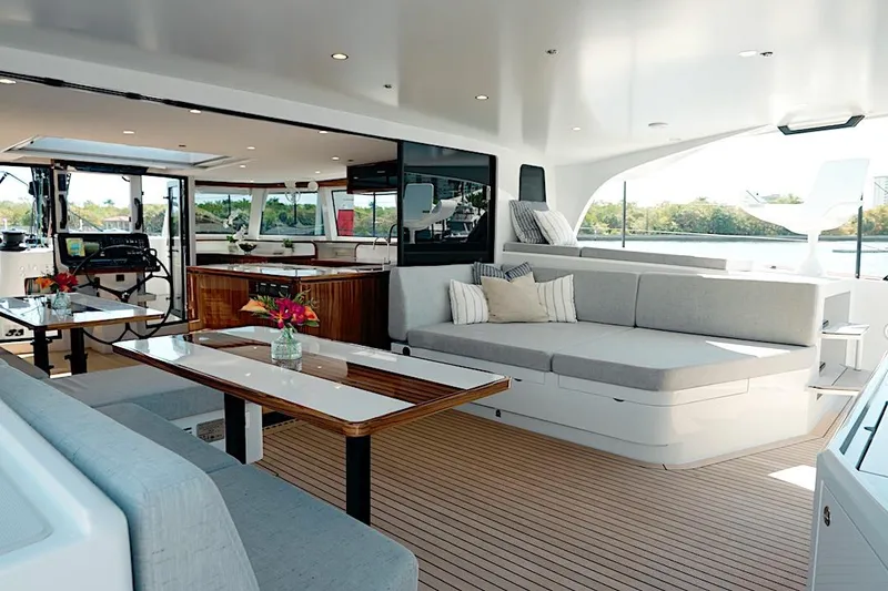 Slide: The Image of Luxurious interior of 2026 HH Catamarans HH60 with modern seating and elegant dining area. - 19