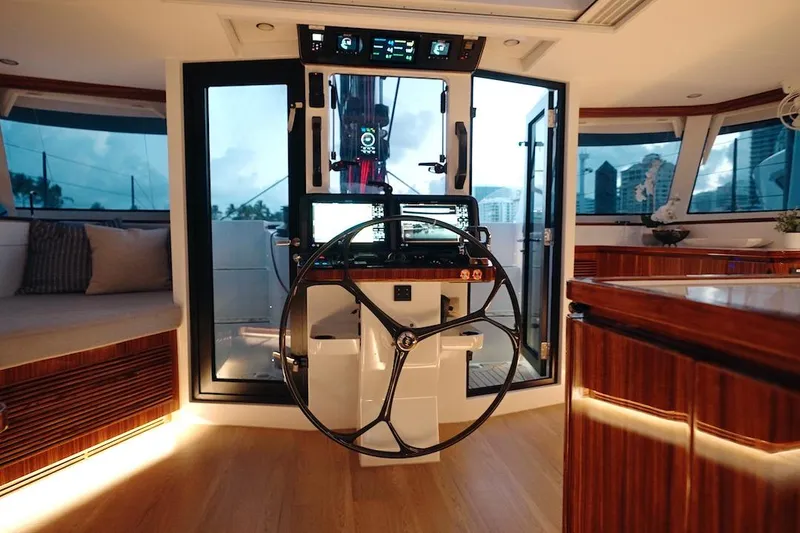 Slide: The Image of Luxurious interior of 2026 HH Catamarans HH60, featuring modern helm and elegant wood finishes. - 24