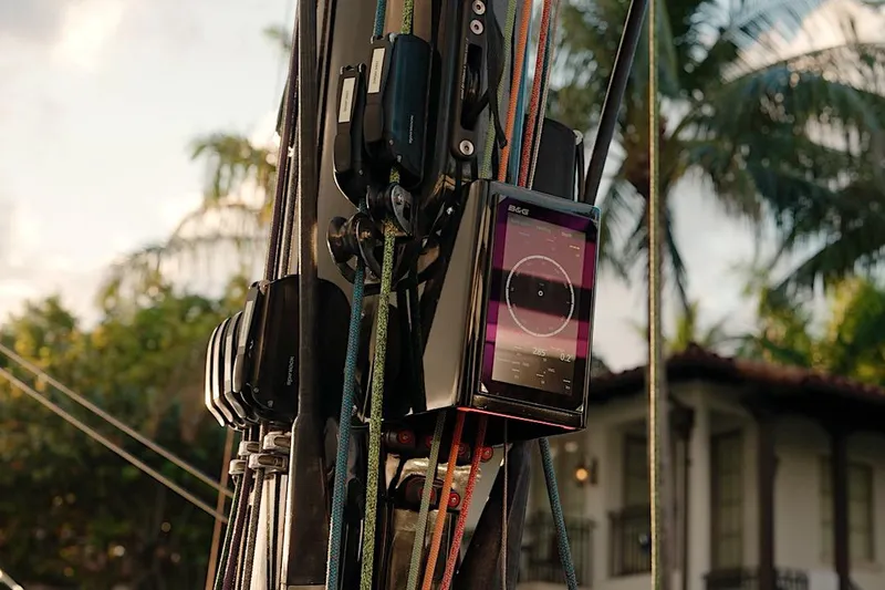 Slide: The Image of Close-up of HH Catamarans HH60 rigging with navigation display, 2026 model, tropical background. - 28